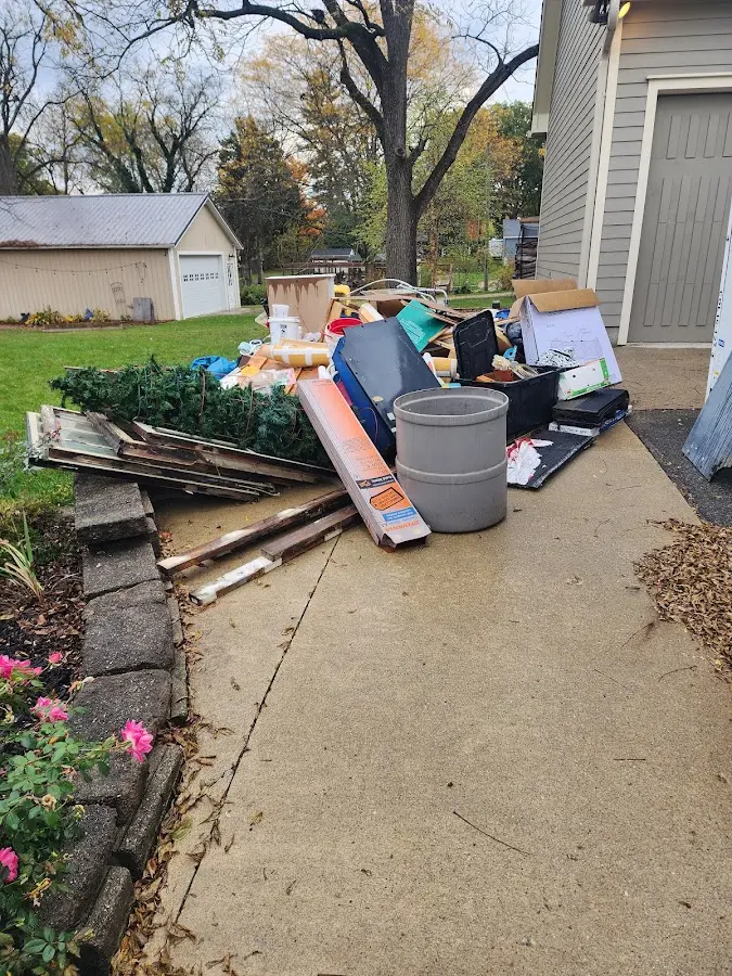 Dumpster being loaded with debris for 30 Yard Dumpster Rental in Napa